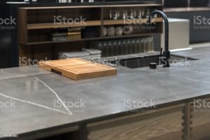 Sleek Stylish Stone Kitchen worktop with sink and chopping board